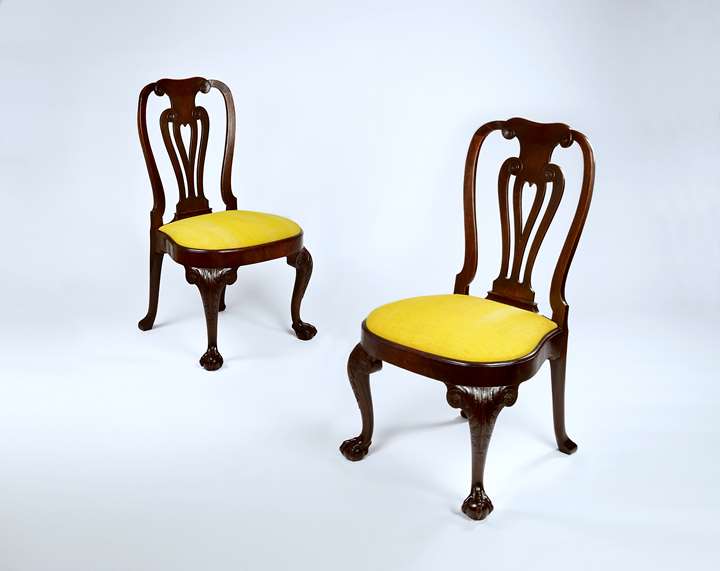 A fine pair of carved mahogany side chairs